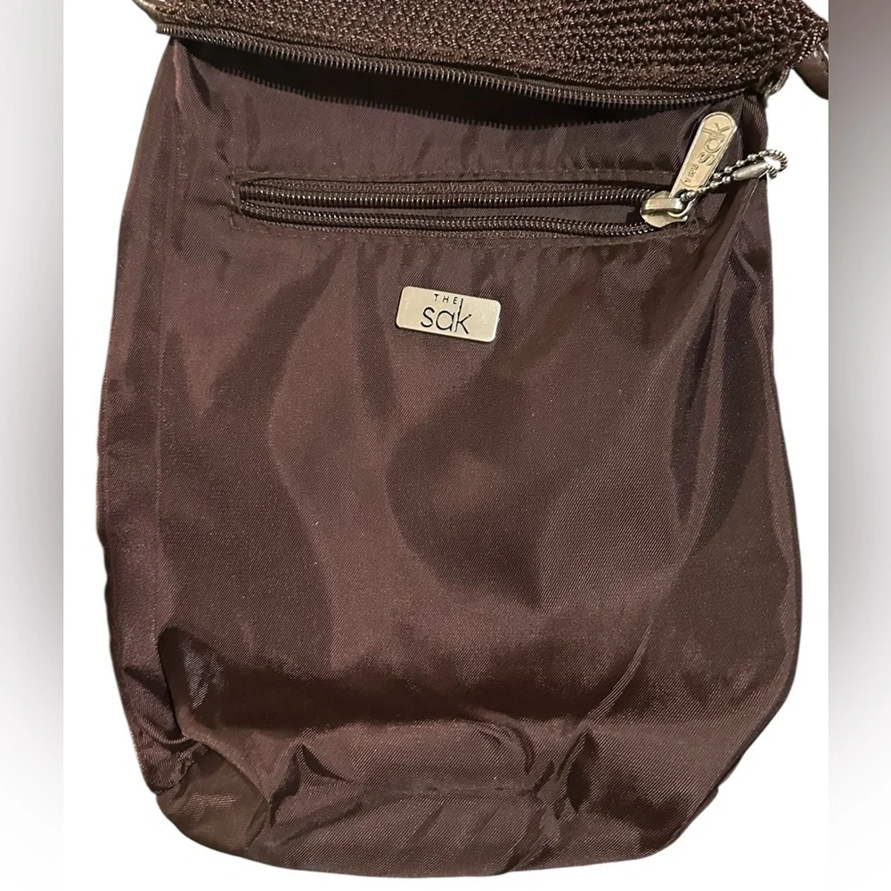 The Sak crochet brown woven shoulder bag / hobo handbag.